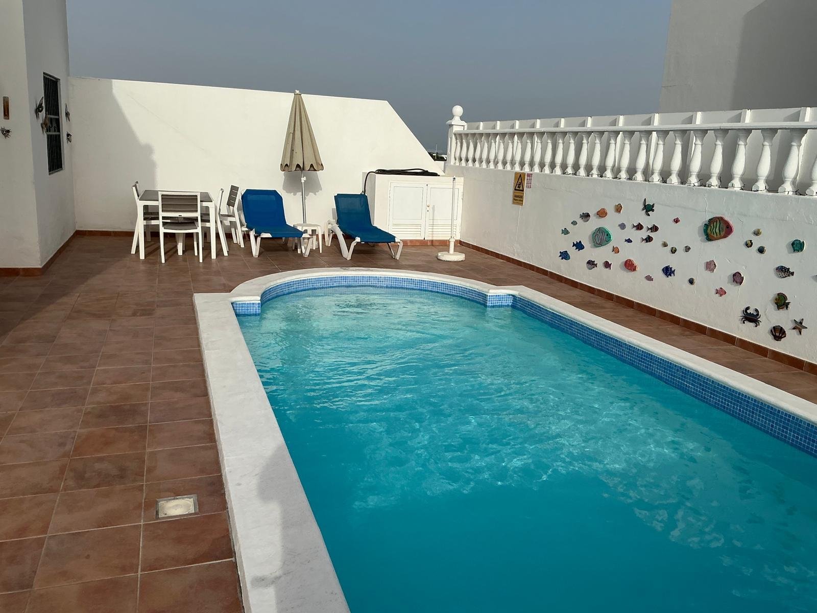 Poolside loungers under the Canarian sun